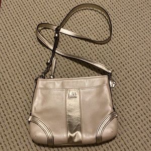 Light tan shimmery coach cross body bag